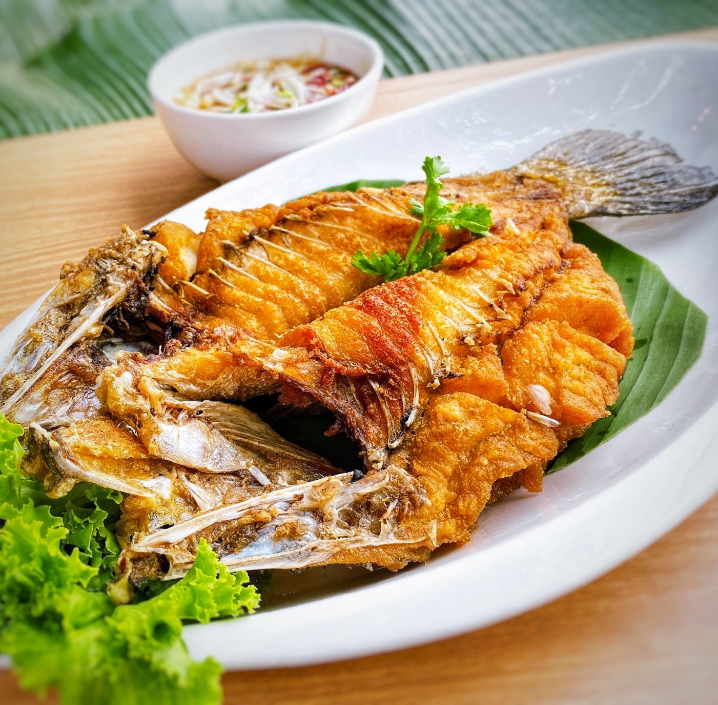 ปลากระพงทอดน้ำปลา ( Deep Fried Sea Bass Seved with Special Fish Sauce )